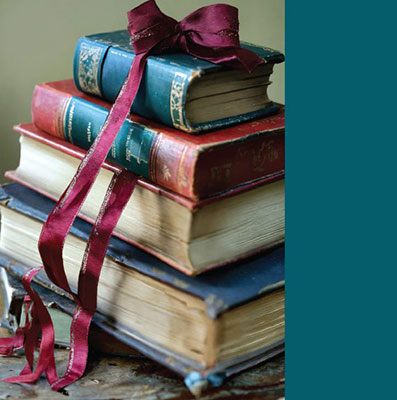 image of stacked books for the little women play
