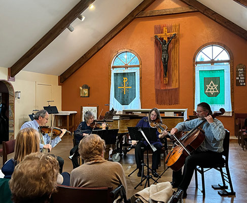 musicians playing in the auditorium of a church